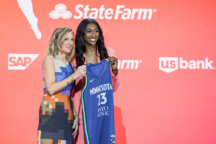 WNBA Commissioner Cathy Engelbert poses with Diamond Miller poses for a photo.